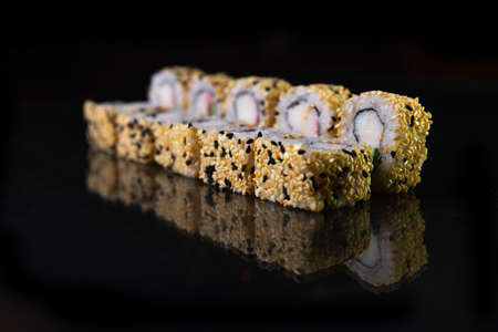sesame rolls, reflected against a black background.の写真素材