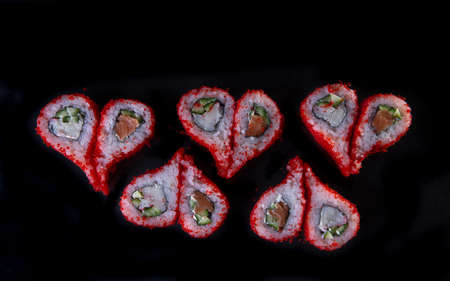 rolls with red caviar in the form of a heart. creative sushi serving.の写真素材