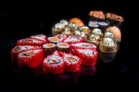 rolls with red caviar close-up on a black background. Japanese cuisine.の写真素材