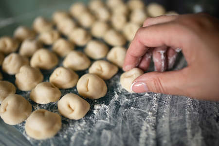 Top view of homemade pasta ravioli over a flour table.の写真素材