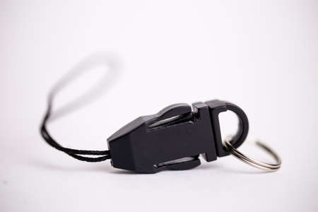 black plastic lock close-up on a black background.