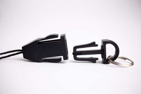 black plastic lock close-up on a black background.