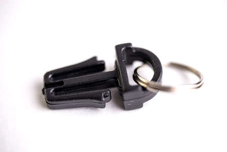black plastic lock close-up on a black background.