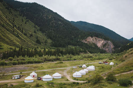kazakh yurts at the foot of the mountains in summer.の写真素材