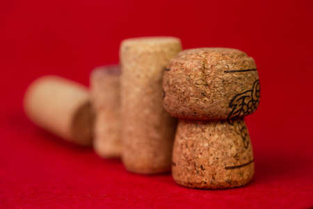 wine corks close up on a red background.の写真素材