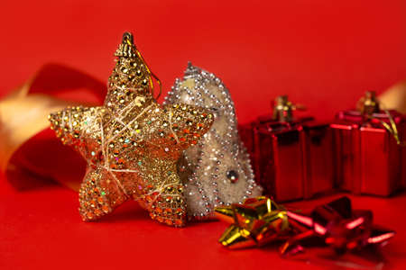 christmas toy golden star on a red background.