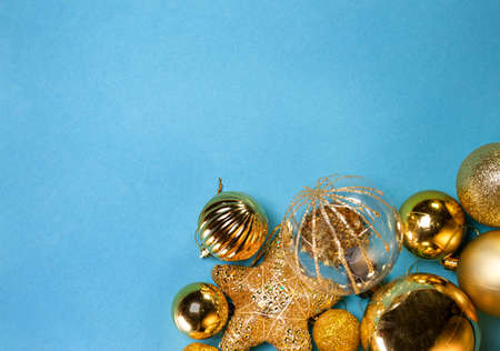 New Year or Christmas backgrounds: golden toys, top view, copy space.の写真素材
