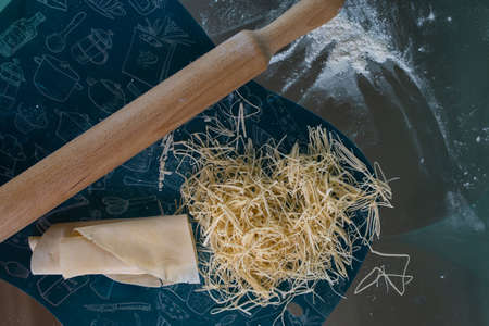 dough for making homemade noodles on the table.の写真素材
