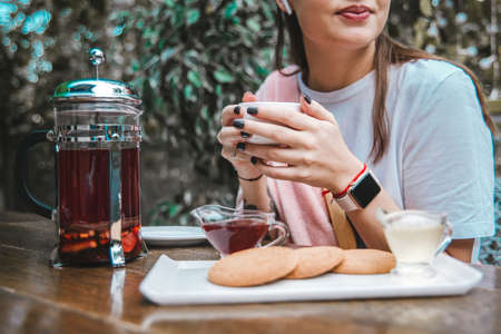 cookies on the table against the background of a girl.の写真素材