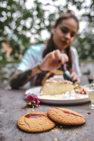 cookies on the table against the background of a girl.の写真素材