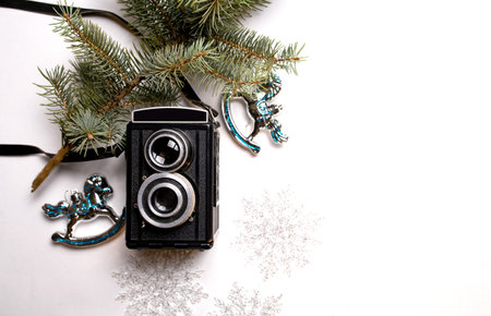 vintage camera and christmas decorations on a white background.の写真素材