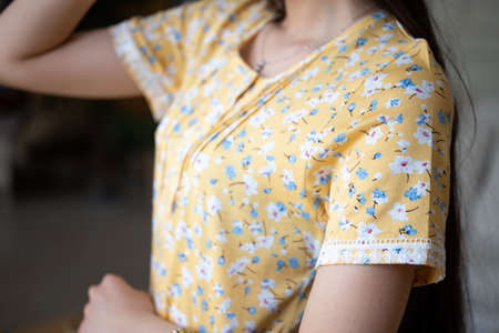 The details of the yellow sundress are not close-up to the girl.の写真素材