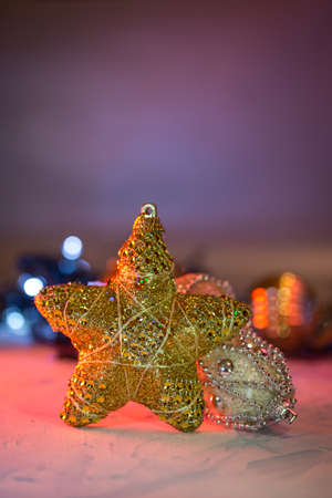 christmas decoration shiny ball and star on bokeh lights background