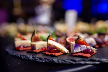 snack with soft cheese and figs close-up.の写真素材