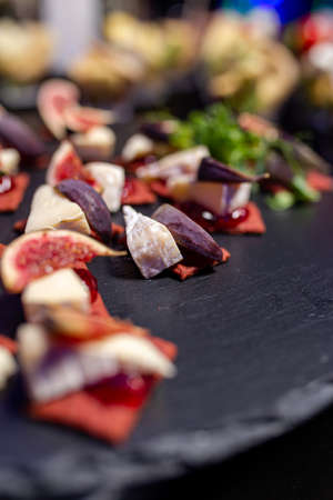 snack with soft cheese and figs close-up.