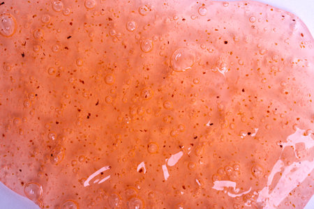 close-up of an orange gel on a white background