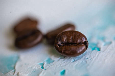 coffee beans close-up on textured backgroundの写真素材