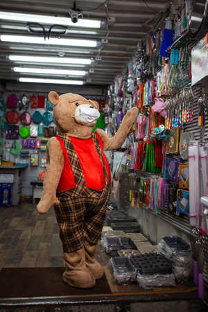 a toy bear chooses products on the market.の写真素材