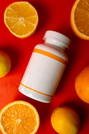 top view white plastic jar with oranges.の写真素材