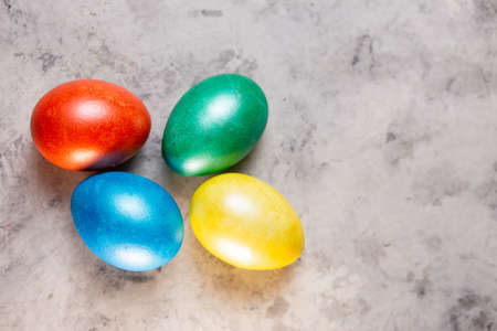colorful festive easter eggs on a marble background.の写真素材
