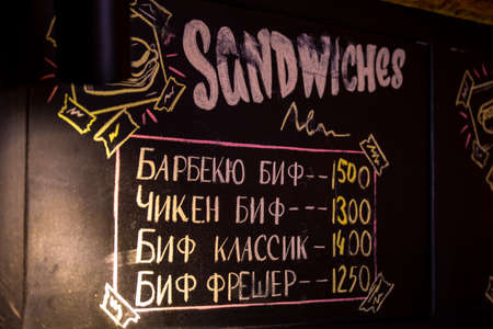 chalk board with menu promotion in cafe.の写真素材