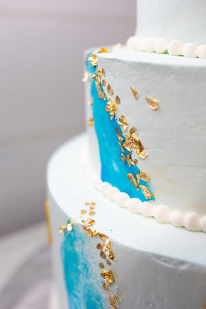 beautiful big cake with gold. delicious festive dessert.