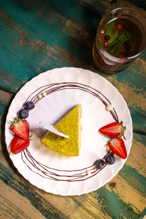top view pistachio fresh delicious cheesecake on a plate.