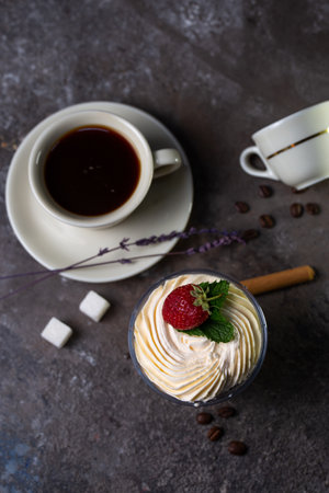 tiramisu with strawberries with a cup of coffee.の写真素材