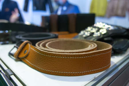 handmade leather belt on display for sale.