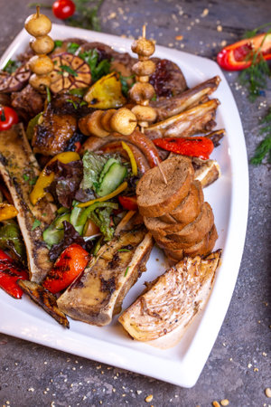 A set of different beef meat dishes on a white plate.