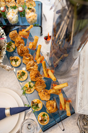 top view plate with snacks and pancakes on the buffet table.