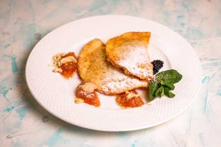 sweet berry cheburek with jam, ice cream and strawberries