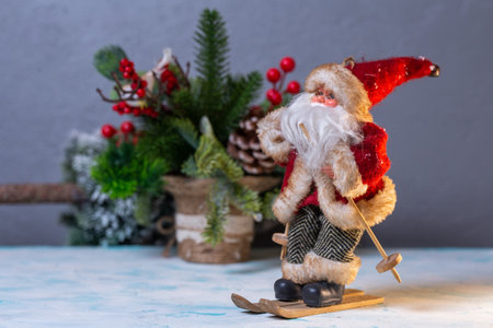 a toy figure of Santa Claus on skis goes on holidayの写真素材