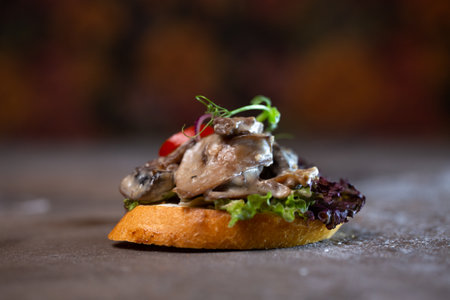 close-up bruschetta with mushroom sauce and tomatoの写真素材