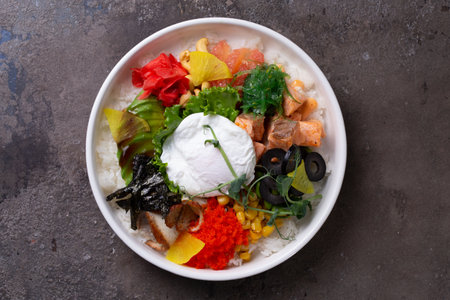 A delicious and healthy poke bowl filled with fresh ingredients like avocado, cucumber, edamame,...