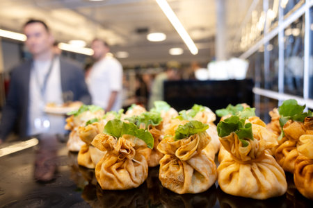 Stuffed pastry pouches with lettuce on buffet table - catering at business event