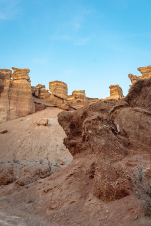 Wide shot of canyon with bizarre rock formations under clear blue sky - wild natureの写真素材