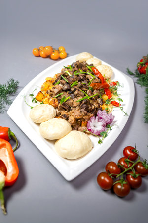 Top view of a dish with braised meat and potatoes.の写真素材