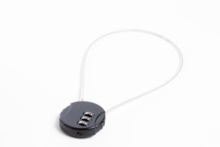 ompact black combination lock with code and sturdy cable for bike, bag, or luggage security. Easy to...