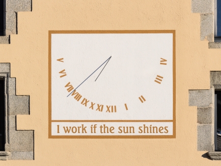 Sundial with the legend  I work if the sun shines の写真素材
