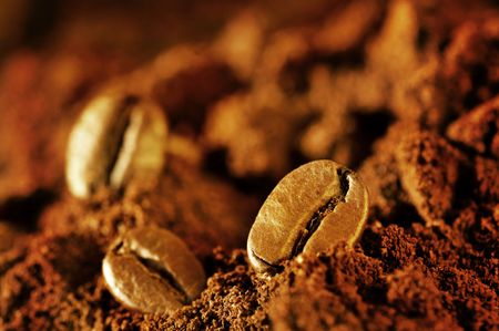 Macro coffee beans and ground coffeeの写真素材