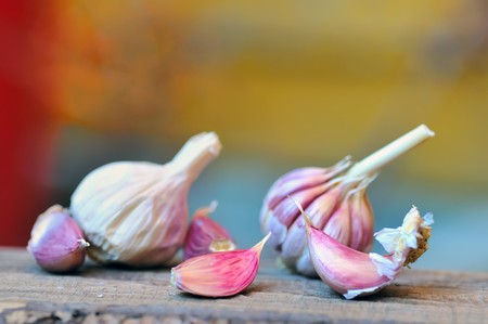 Garlics on old woodの写真素材