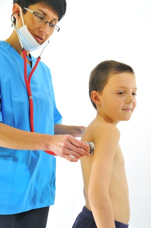 female doctor examining little child boyの写真素材