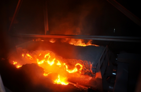hot ore on conveyorの写真素材