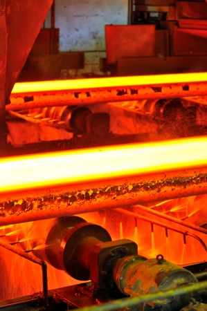 hot steel on conveyorの写真素材