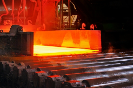 hot steel on conveyorの写真素材