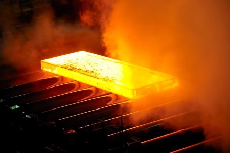 hot steel on conveyorの写真素材