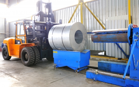 machine for rolling steel sheet in warehouseの写真素材