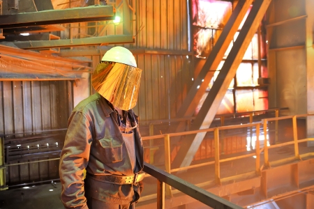 mill worker with hot steel の写真素材