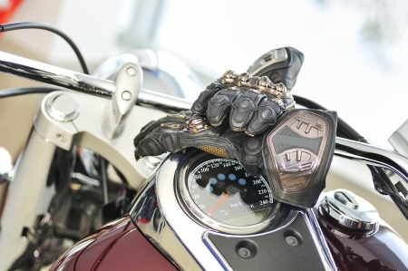 motorcycle gloves with carbon on bikeの写真素材